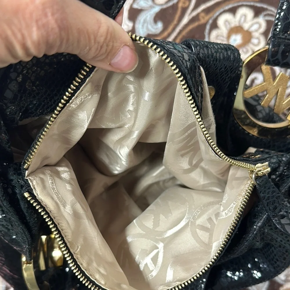 Michael Kors Black Hobo Bag with Gold Emblem